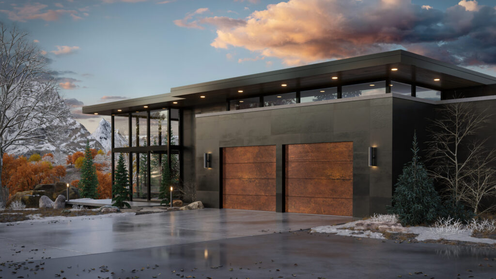 Modern house with large glass windows, flat roof, and two wooden garage doors, set in a snowy landscape with autumn-colored trees and distant mountains under a cloudy, picturesque sky.