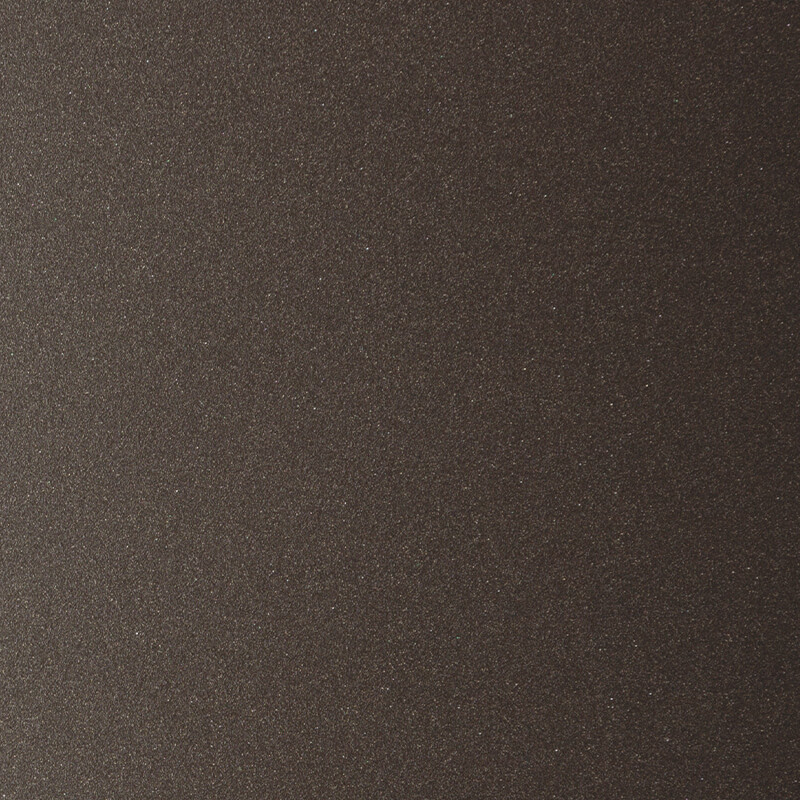 Close-up of a textured, dark brown surface with a subtle shimmer, possibly sandpaper or a finely grained material.