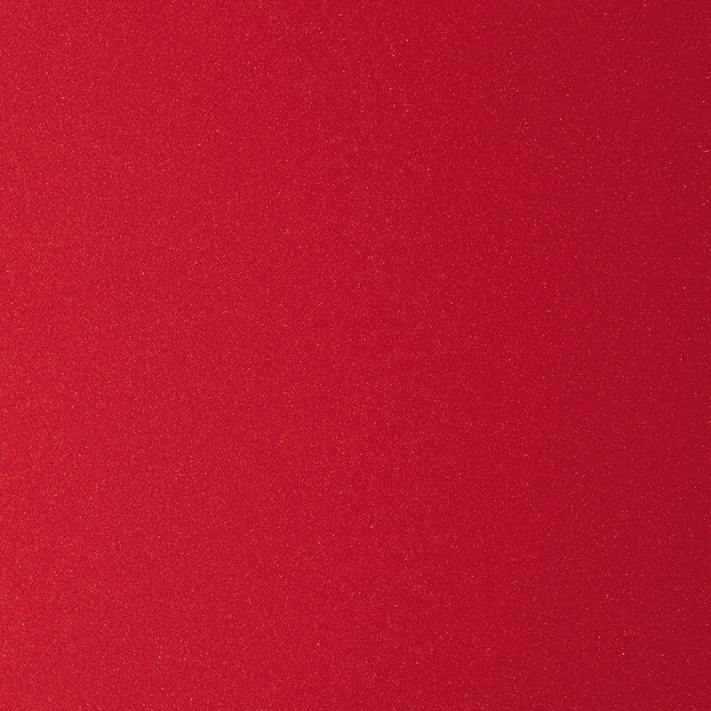 A close-up image of a textured red surface, possibly fabric or paper, with a consistent and solid color throughout.