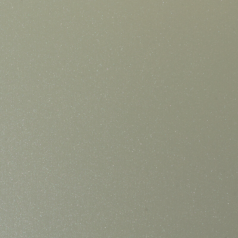 A close-up view of a smooth, light beige surface with a subtle, fine glittery or sparkly texture, creating a shimmery effect throughout the image.